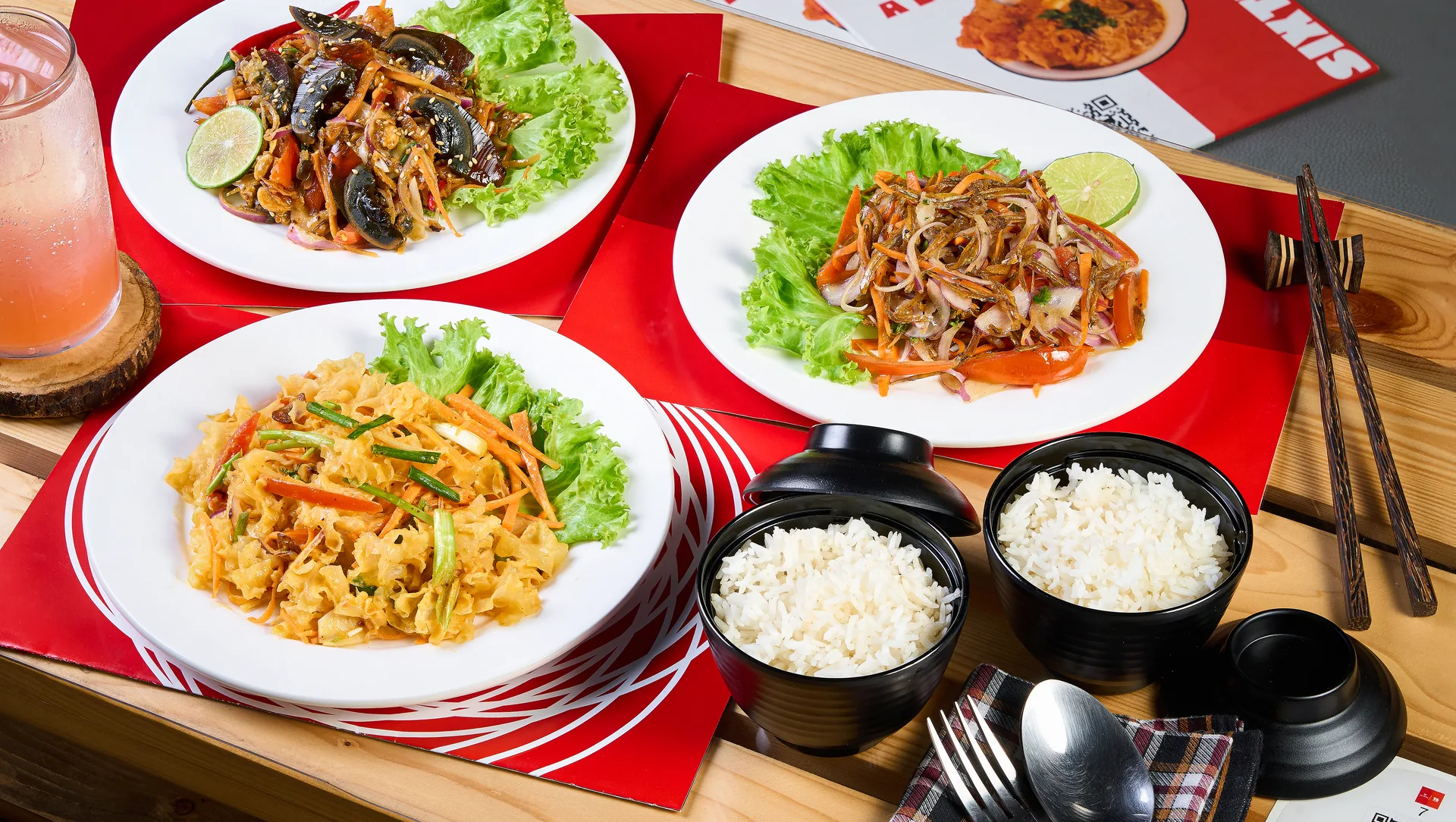 Asian dishes served with rice at Sixteen Plates